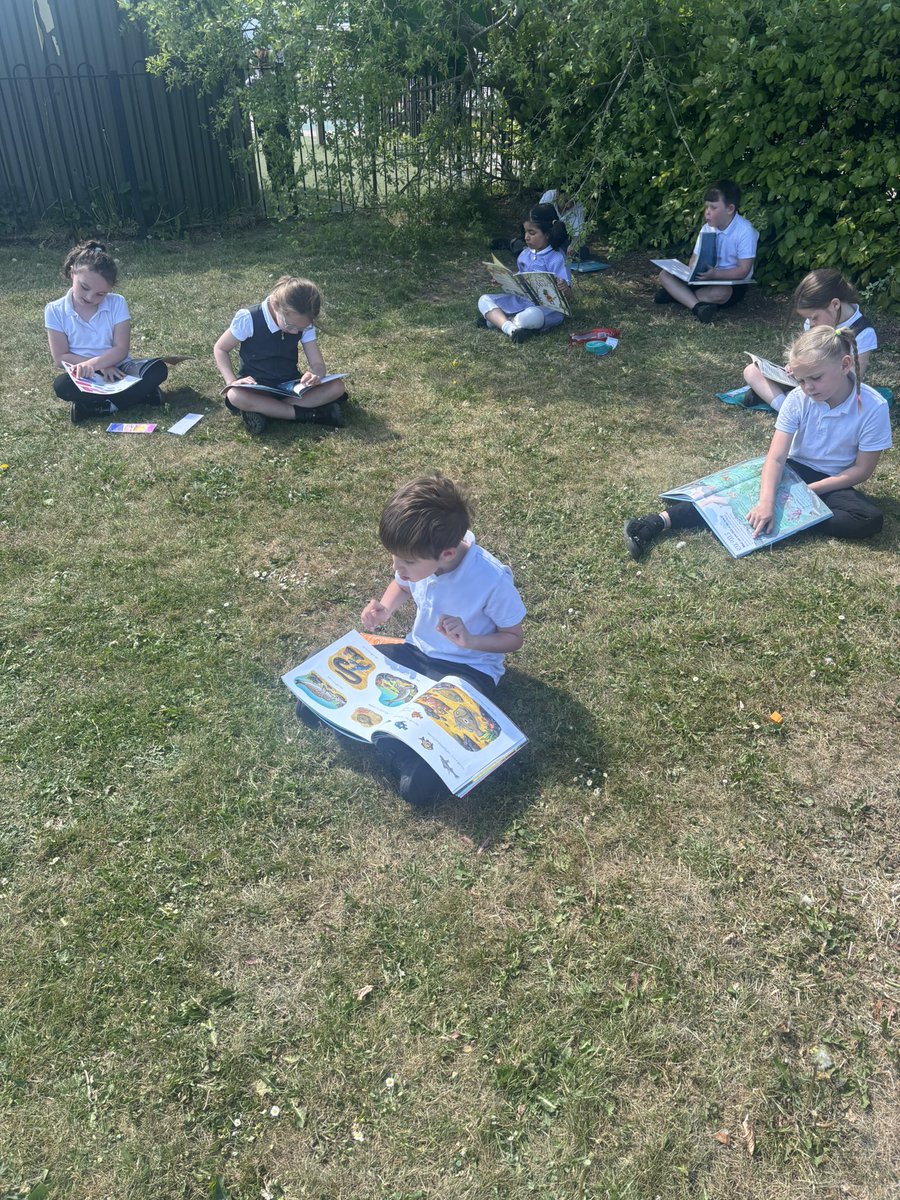 Year 2 are making the most of the sunshine reading our Reading Routes books outside ☀️📚