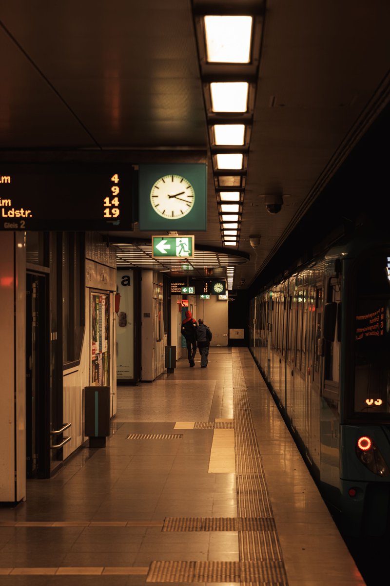 In evening's glow, the station breathes,
A sleek train waits, reflections gleam,
Shadows drift, lights softly guide,
A quiet hum where journeys hide.

#Urban #City #Street #Train #TrainStation #FrankfurtAmMain #Germany
