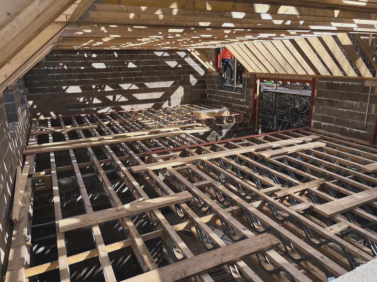 Client site photos: trusses on and ready to felt/batten on a new build home.