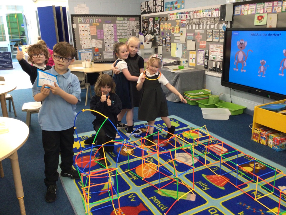 Pupils in P1/2 are enjoying collaborating to follow building instructions.