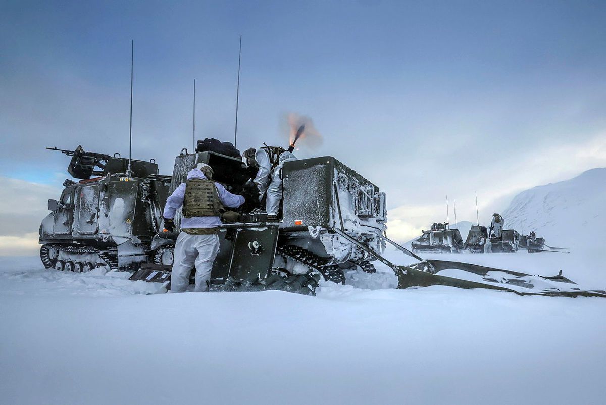A Royal Marine Commando Mortar team operating from a Viking. Nestled in a valley high in the Norwegian mountain, Mortar Troop of 45 Commando launched an array of ordinance from Royal Marine Commando Vikings.