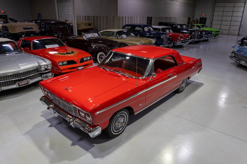 1965 Ford Fairlane 500. This Rangoon Red #Fairlane has a stellar look and is fun to drive. It sports a 289 V8 fed by an a pair of Edelbrock 4 barrel carburetors mounted atop an aluminum intake manifold. See more on our website. #fordfairlane ellingsonmotorcars.com/inventory/1097…