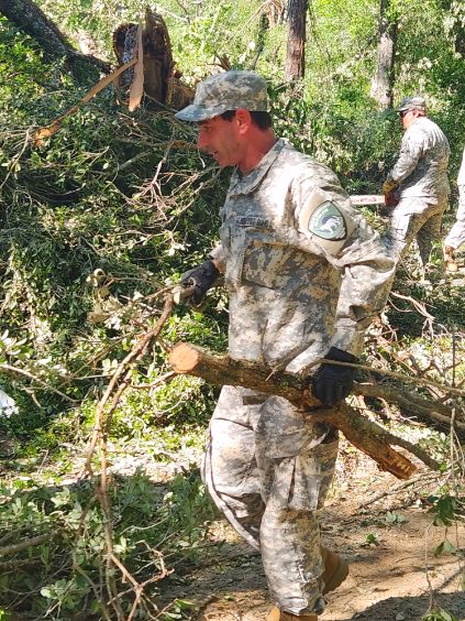 FLStateGuard's tweet photo. Boots on the Ground - FSG is in Holmes County to provide support by removing debris and assisting Floridians impacted by destructive tornadoes. We stand ready to assist anytime, anywhere. https://t.co/PzYnA8hocf