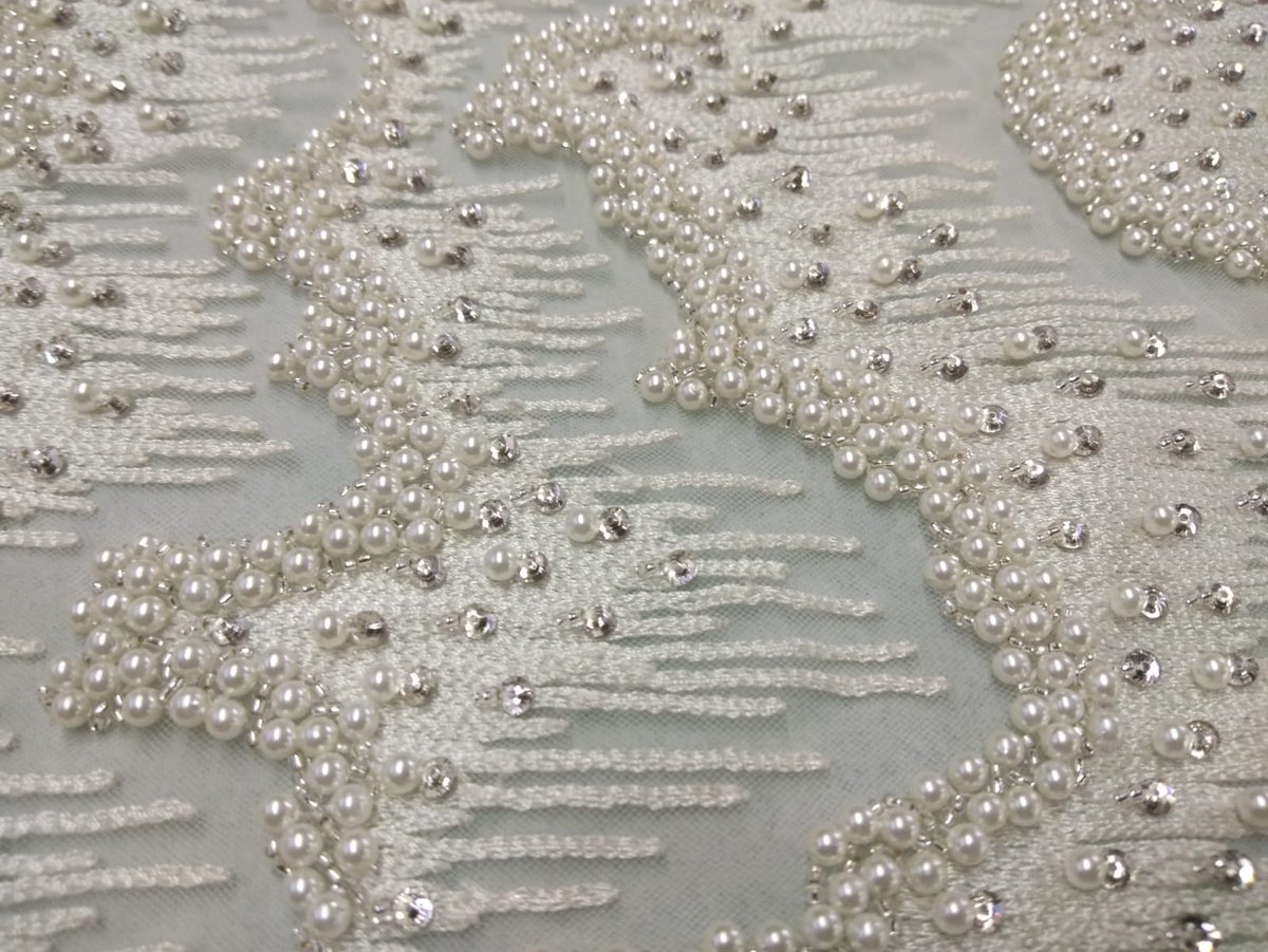 Elegant pearl &amp; crystal hand embroidery on textured threadwork – perfect for bridal &amp; couture creations. A touch of timeless luxury by Sadul Badul.

Contact: info@sadulbadul.com | +91 91363 04295
Visit: sadulbadul.com

#SadulBadul #PearlEmbroidery #CoutureDetails