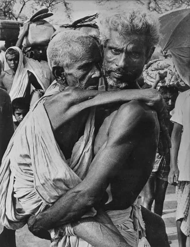A moment from a Hindu genocide that the world had decided to ignore and forget - 

Photo of a 79 year old Hindu man carrying his 99 year old mother, as they escape the Hindu genocide that the Pakistani army was carrying on in East Pakistan, October 1971. The son had told the