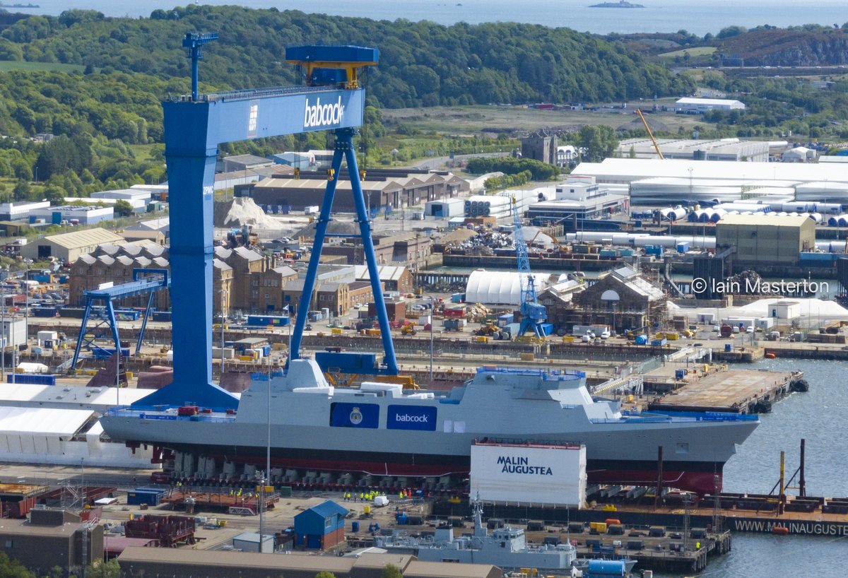 New Royal Navy Type 31 Frigate HMS Venturer rolls out from her ship build hall into sunshine at Babcock's shipyard at Rosyth in Fife.