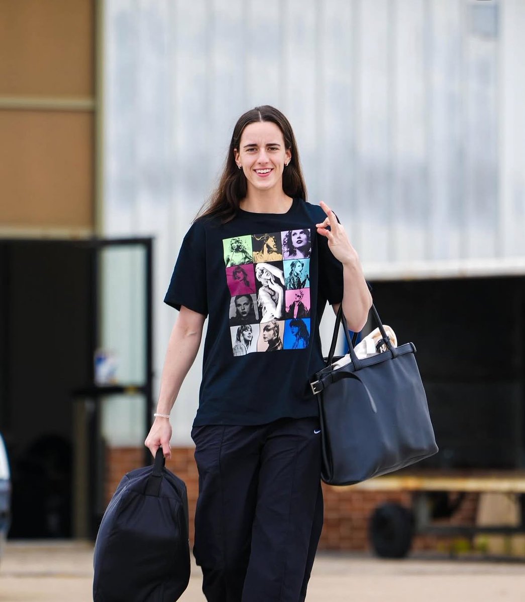caitlin clark repping taylor swift while traveling with the team!