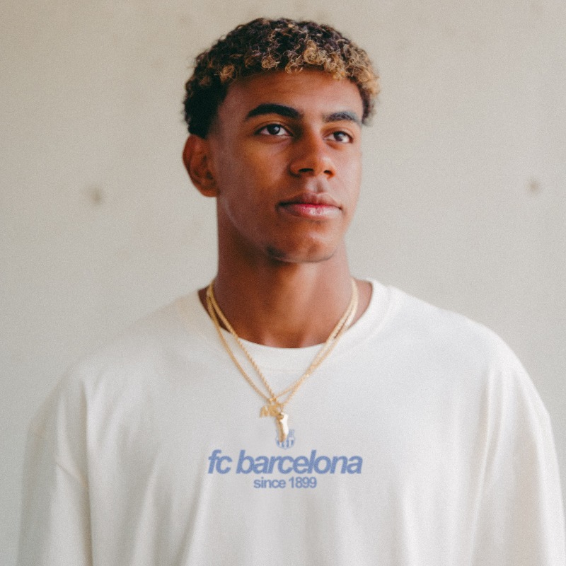 FCBarcelona's tweet photo. He dances past defenders like they are standing still.
Then he signs for six more years.
2031 isn't the limit. It's the launchpad.
This T-shirt doesn’t carry a date or a headline.
It carries the feeling of knowing he’s ours.