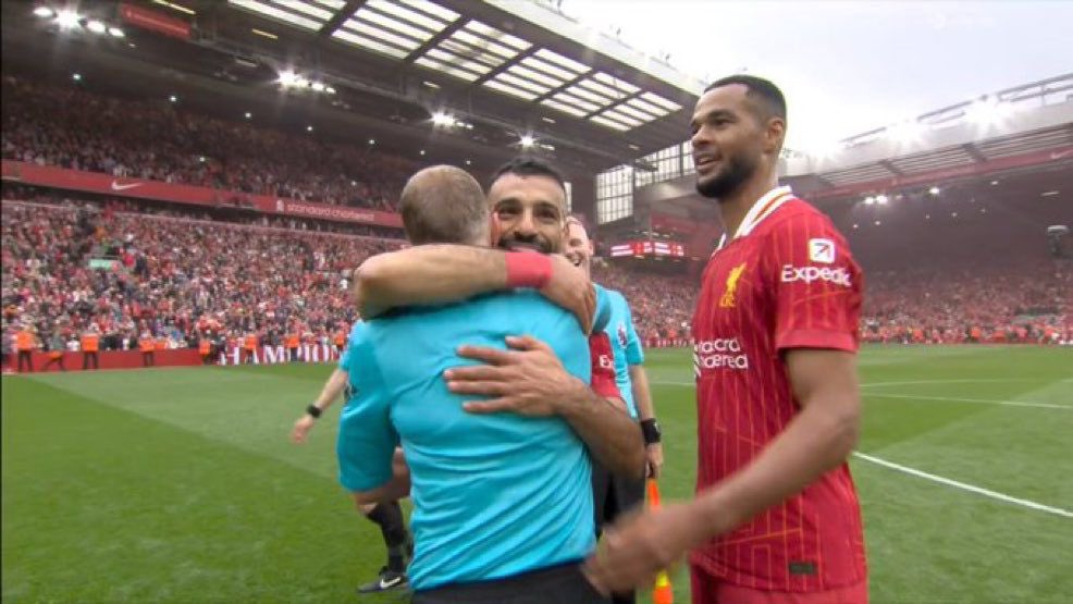 Liverpool’s player of the season and Mo Salah share an embrace at the final whistle today