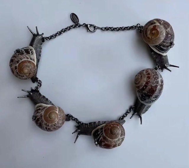 Iithosphere's tweet photo. Vivienne Westwood snail bracelet https://t.co/6ybit9sZ1g