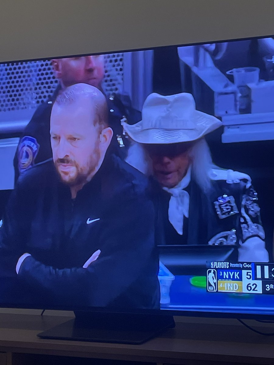 RedbirdCraig's tweet photo. Can someone explain this guy dressed like an undead Rhinestone Cowboy behind Thibs?  #Knicks #Pacers https://t.co/kHyFizbseD