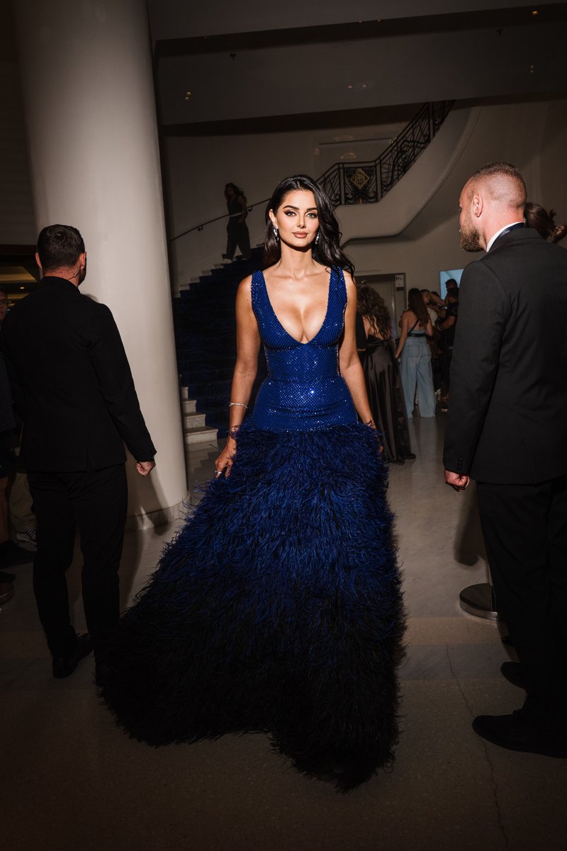 Model <a href="/MahlaghaJaberi/">Mahlagha</a> wears a custom deep blue beaded bodice with a voluminous feathered skirt fading into black at the “La Venue De L’avenir” red carpet during the 78th Annual <a href="/Festival_Cannes/">Festival de Cannes</a>.

#Cannes2025 #78thCannesFilmFestival
 #MahlaghaJaberi #RamiKadi #Cannes