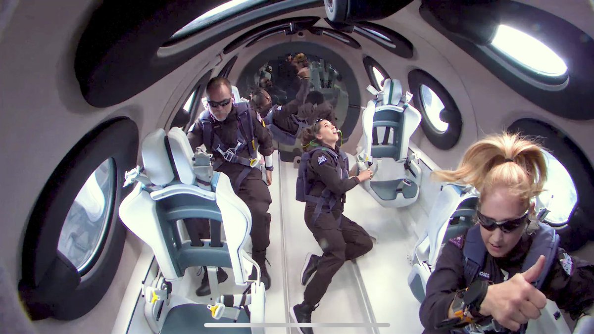 Astro_Beth's tweet photo. May 25, 2023. Cabin test underway. 
I’ve just confirmed the predicted apogee callout from the cockpit as well as verbally and visually acknowledging our clearance to unstrap. This was a test flight crewed by company employees; I managed the cabin test program. #Unity25 https://t.co/A7C9YfyKwN