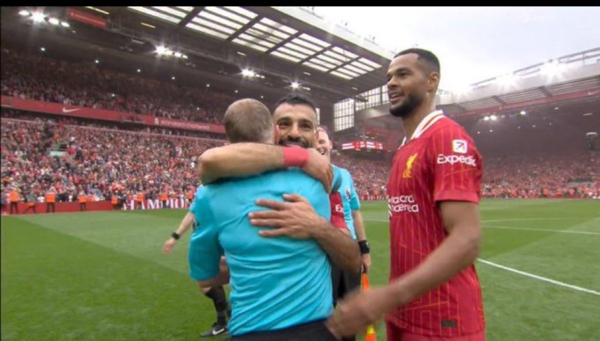 Salah celebrating the Premier League with his teammate.