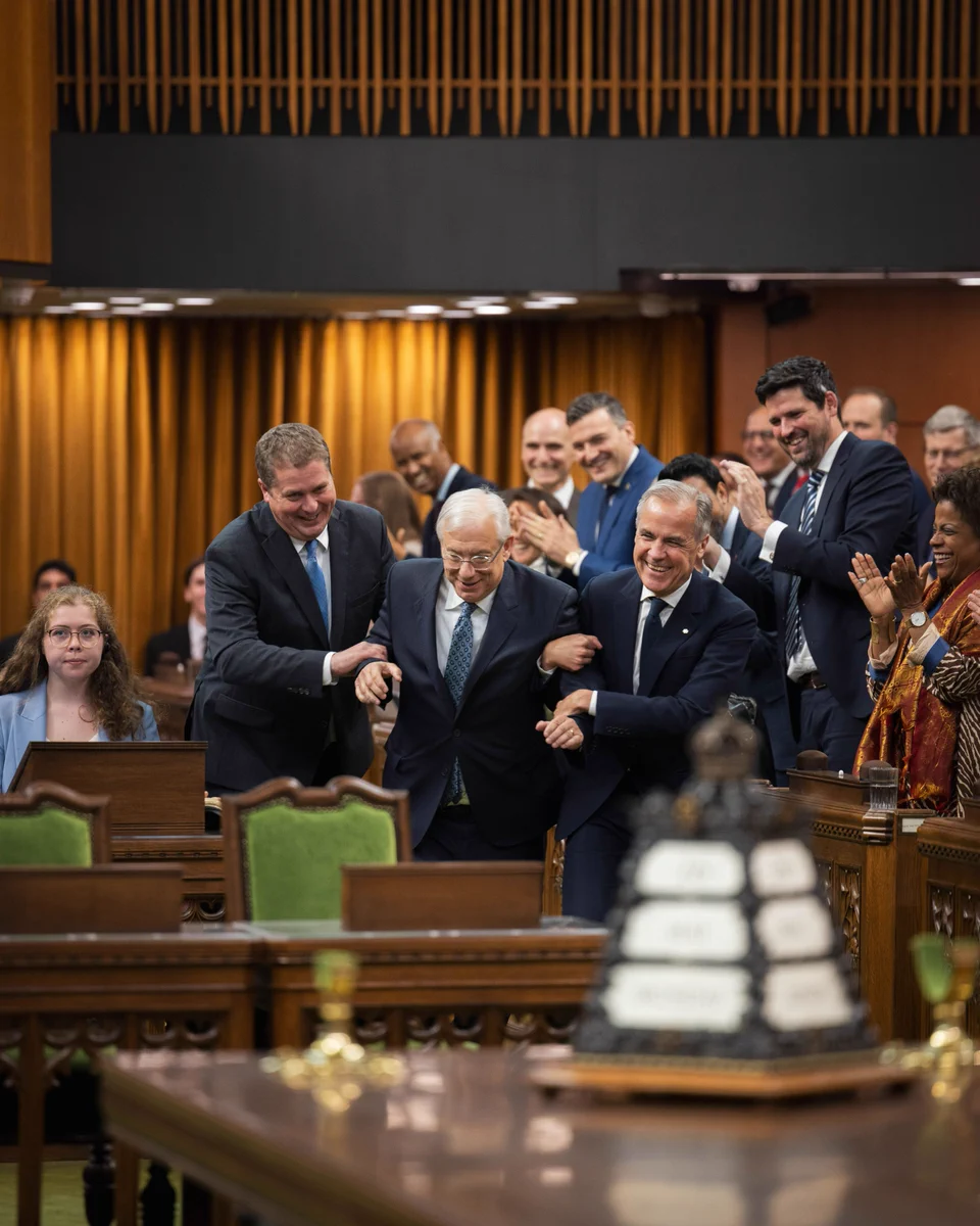 Prime Minister Mark Carney and the Leader of the Official Opposition ‘drag’ the newly elected Speaker of the House, Francis Scarpaleggia, down the aisles of the Chamber as Members of Parliament applaud.