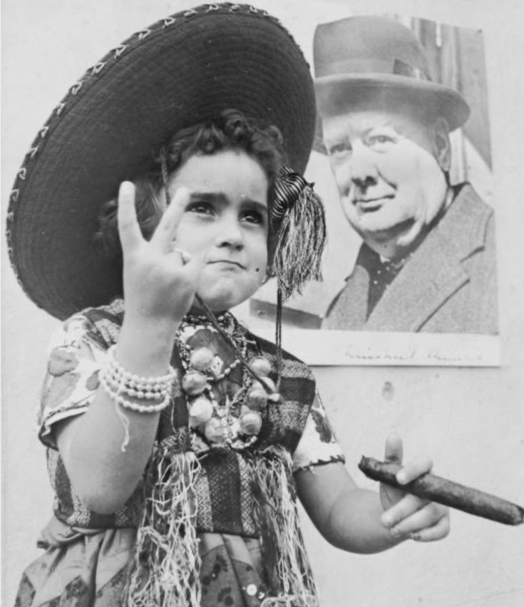 Esperanza Armoux, age 4, wins a Mexican-government-sponsored contest for posters supporting the Allies against the Axis. 

(Circa 1943; Michael Ochs Archives)