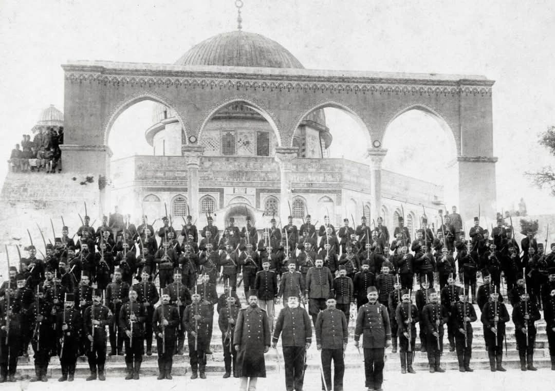 freemonotheist's tweet photo. Ottoman soldiers standing outside of Qubbat as-Sakhra (Dome of the Rock) within the Al Aqsa Compound circa 1889. A more just and peaceful era under Muslim rule.
