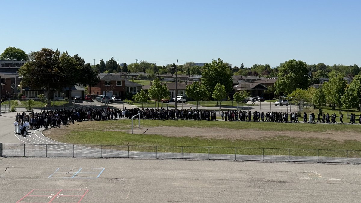 Students from St. Wilfrid and St. Jerome in a procession following the Virgin Statue of Fatima.