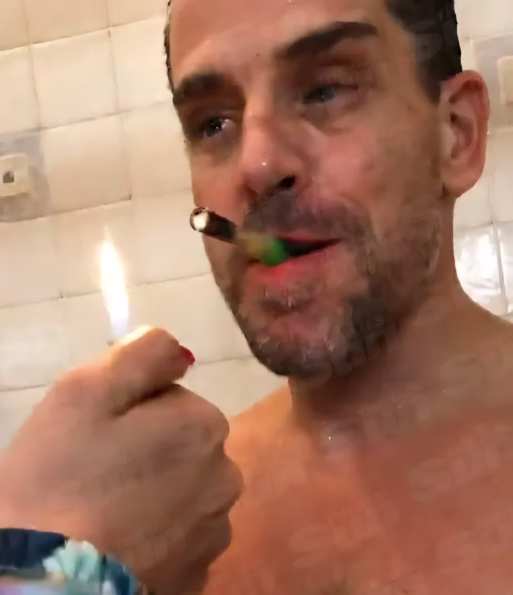 Crackhead criminal Hunter Biden allegedly smoking a crack rock.