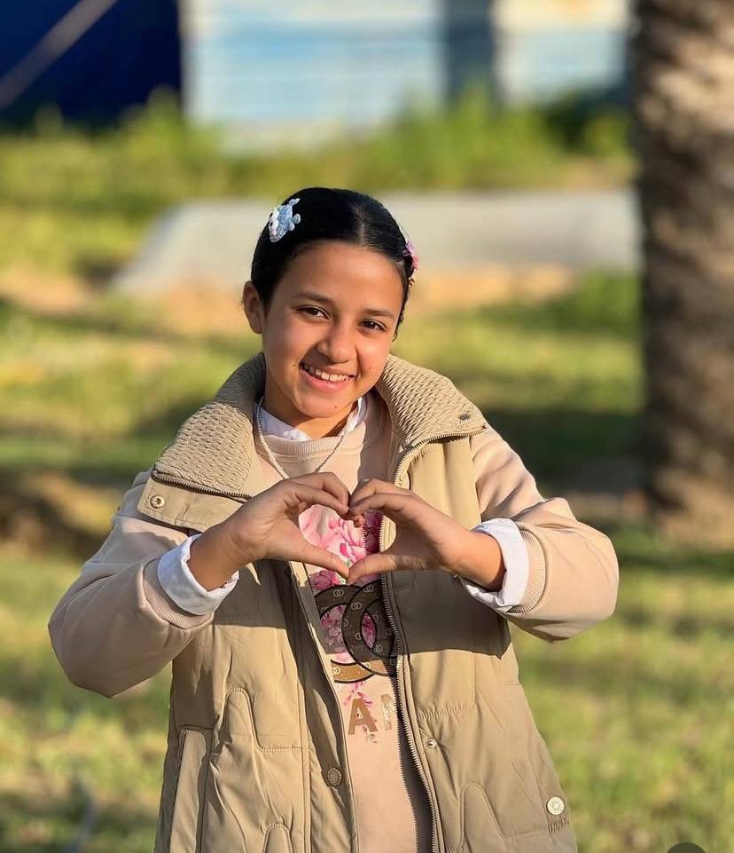 GazaMartyrs's tweet photo. Yaqin: Gaza’s Unbreakable heart promised her people:"We will rebuild Gaza again."

While bombs fell and the world looked away, Yaqin stayed feeding the hungry, helping people, and holding onto faith. She memorized the Quran not just with her mind, but with her soul, finding strength in its words as death surrounded her.  

But Israel’s war machine couldn’t bear her light. They killed her, like they’ve killed thousands, stealing another life, another dream.  

Yaqin is gone, but her promise remains: "Gaza will rise." Because love outlasts even the darkest hate.