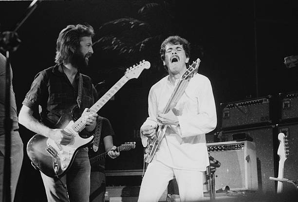 Eric Clapton and Santana on stage, 1975. Photo by Michael Putland.