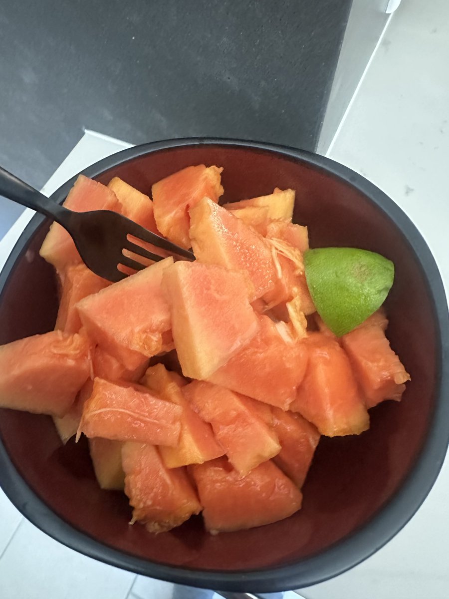 Breakfast. Fresh cut up papaya with lime juice