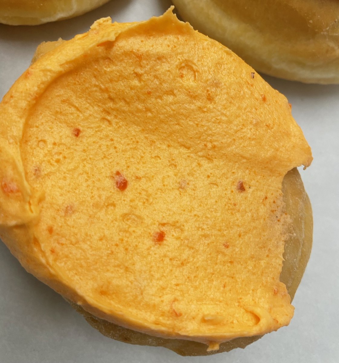 This is the last special for strawberry month. It’s a strawberry filled donut topped with our homemade orange buttercream icing. We added this combination to our May rotation, and it’s become a popular special. This is a delicious combination we know you’ll love.