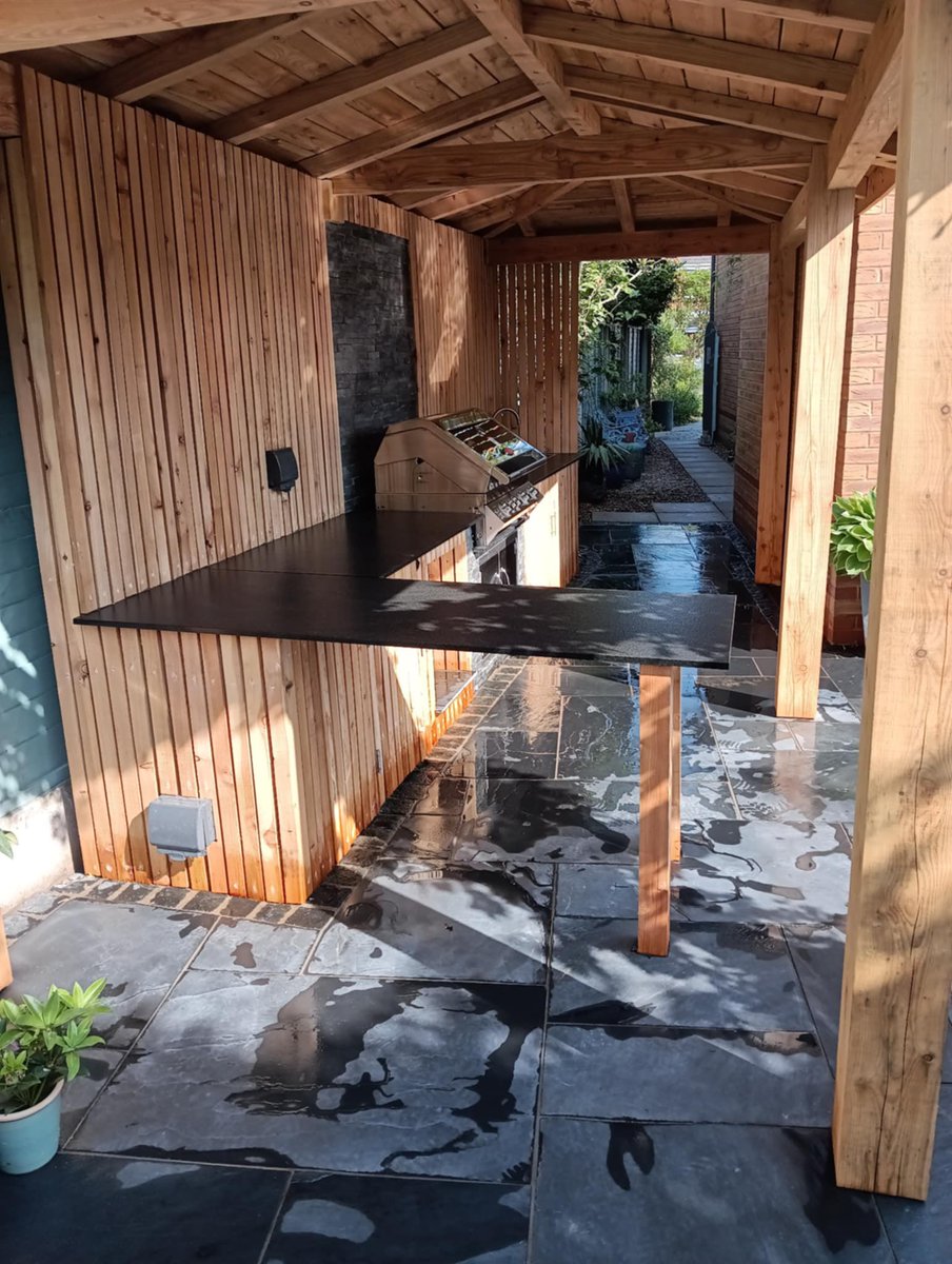 Kitchen garden building is larch and so is the board with Marshalls paving and walling #marshallpaving