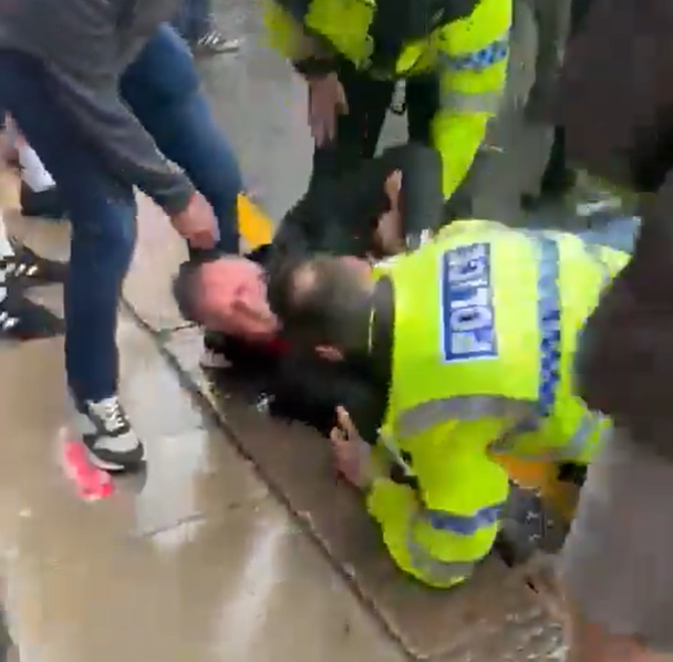 BasilTheGreat's tweet photo. I don't think the Police have released the description of the driver behind the attack in Liverpool

I think the 53 year old white man everywhere is reporting has been arrested is this man who clashed with Police at the scene as they held him back https://t.co/r9TSpX0ZGx