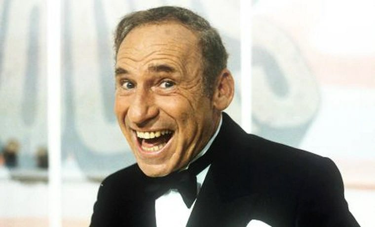 ofComedyHistory's tweet photo. Celebrate Memorial Day.  Celebrate Mel Brooks.

Long before “The Producers,” Mel Brooks fought Nazis. At 18, he crossed the Atlantic on a puke-soaked troop ship to unearth landmines in France.

He learned to wield a saber at Virginia Military Institute. He trained as a radio operator at Fort Sill—where mashed turnips masqueraded as potatoes and “shit on a shingle” (chipped beef on toast) became a regular meal.

Then came Europe. His ship, the Sea Owl, was a Liberty ship without stabilizers. Seasick GIs puked nonstop on a journey that zigzagged through U-boat territory. Brooks wrote comedy in the middle of it—penning a satirical column called My Floating Day, joking about saltwater shaving and flying breakfasts.

In Normandy, he was reclassified as a combat engineer. His new job? Clearing Nazi landmines, booby-trapped toilets, and tripwire-triggered “Bouncing Betties”—mines that exploded at chest height. One mistake and it was over.

Still, Mel found humor where he could. When he heard Germans singing across the river during bridge construction, he grabbed a bullhorn and serenaded them with “Toot Toot Tootsie.” He swore they clapped and shouted, “Sehr gut!”

He is primary duty was detecting mines with a bayonet, clearing paths for Allied troops. 

And when the war ended, he celebrated not with wild gunfire—but in a wine-stocked cellar with a friend who knew that what goes up must come down.

Then came the joy: a USO show featuring Bob Hope. Mel couldn’t help himself—he grabbed Hope’s pant leg and demanded an autograph. Years later, on the set of The Tonight Show, he reminded Hope of that moment. Hope laughed and said, “I remember that crazy soldier.”

Brooks’ military service wasn’t just duty—it was the origin of his voice. His satire, irreverence, and love of life were forged in the absurdity of army chow, the terror of a minefield, and the warmth of a French farmhouse.

On this Memorial Day, let’s remember that Mel Brooks didn’t just lampoon fascists—he risked his life to fight them.

He joked that the army didn’t rob him of his youth—it gave him an education: how to stand on your own two feet, how to survive, and how to make someone laugh even when everything seemed bleak.