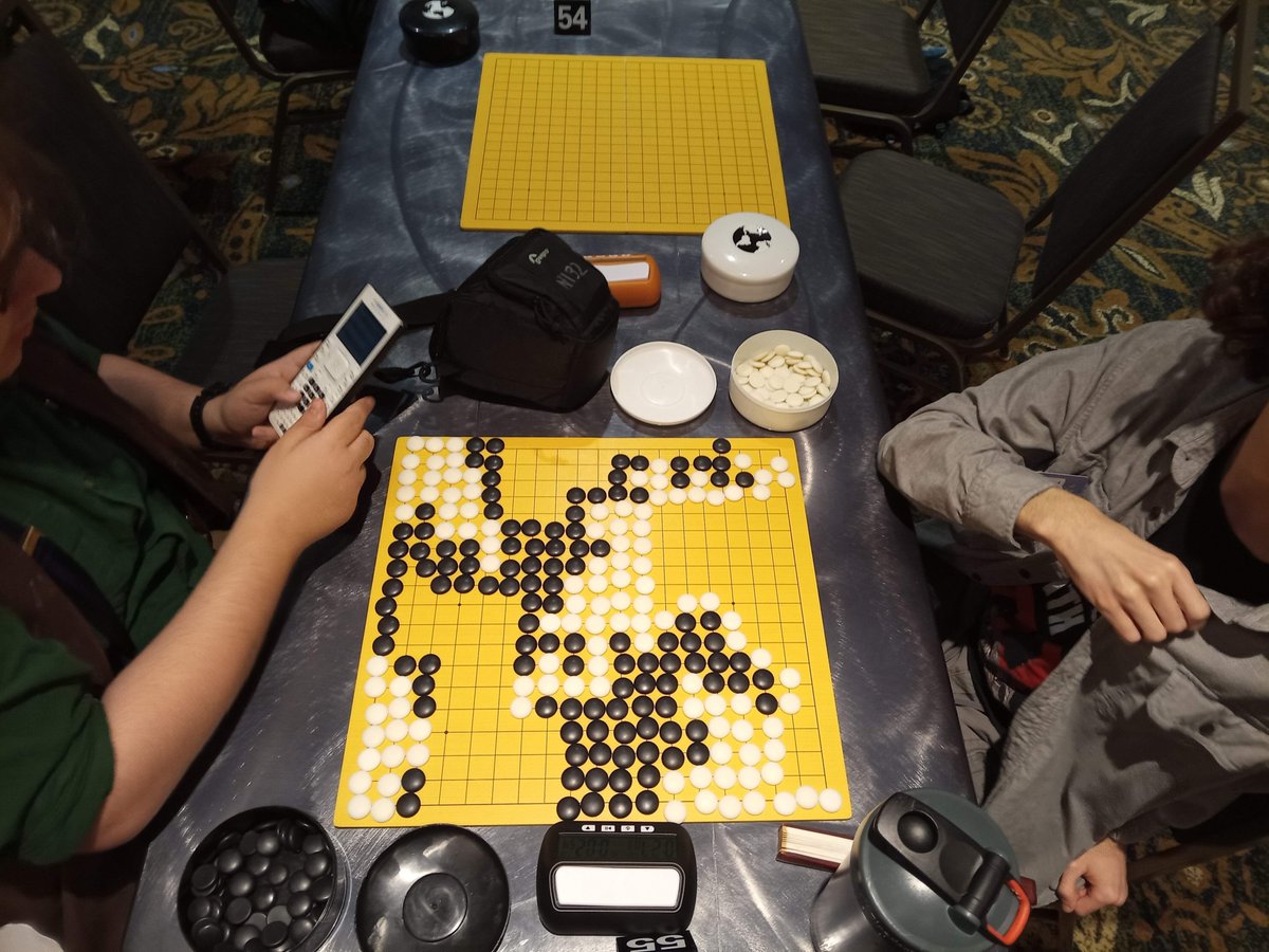 goandmath's tweet image. At Chicago Go tournaments, beginners often use calculators to count territory and captures — and that’s great! Go is an authentic game that gets people using math. After results are confirmed, I show them faster, more intuitive ways to count.