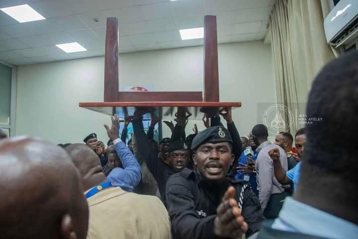 Class 5A pupils returning from Class 5B classroom after fighting for their table: