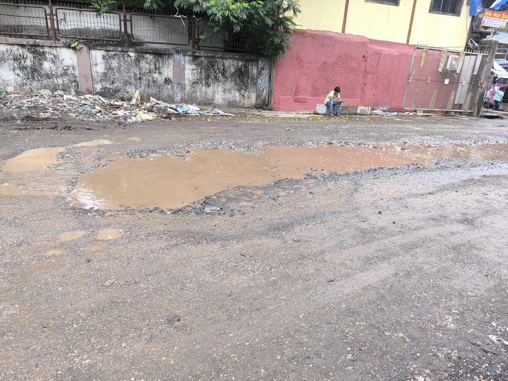 ClubBandra's tweet photo. @mybmc @mybmcWardHE @myBESTBus Requesting urgent action at Bandra East Bus Depot! Multiple large potholes filled with water are making it unsafe for buses and commuters. Please repair the road at the earliest. #Mumbai #Potholes #BandraEast https://t.co/C1KMlgpJfN
