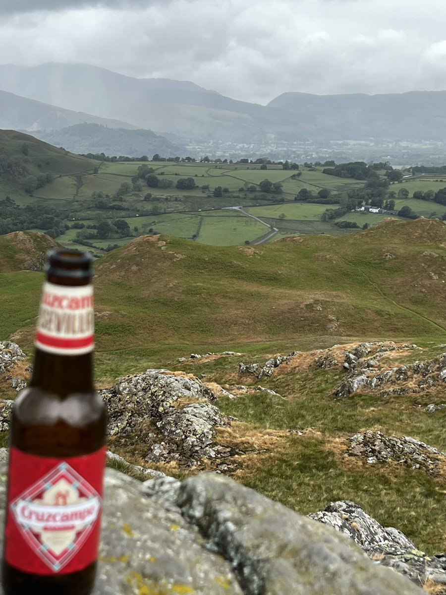 Bottle of Cruzcampo High rigg in the Lake District, even though the weather was a little rainy and cloudy, still spectacular views 

Wainwright no: 8, High Rigg. done ✔️