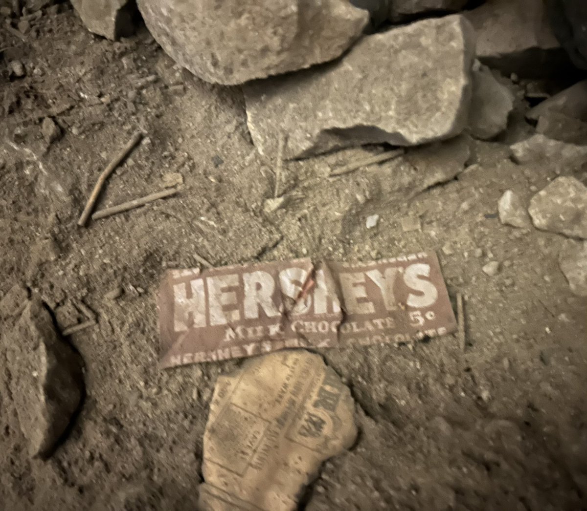 MammothCaveNP's tweet image. Today’s installment of historic trash inside The Mammoth Cave is a Hershey bar wrapper from the 1930s. Hershey chocolate bars were 5 cents from 1900-1969.