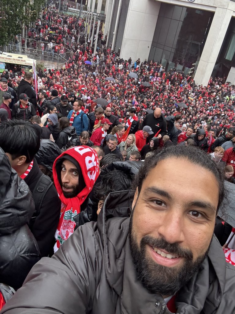 Mo_Ezz14's tweet photo. As a true @LFC fan, I had to be there for the trophy parade.
My day started at Euston station in London, and it was already painted red.
Everywhere I looked: jerseys from every era, scarves waving, songs echoing. The passion was palpable.

A 4-hour train to Liverpool later, I arrived at a buzzing Lime Street.
The moment I stepped outside, I was hit by a sea of red.
Not just jerseys but flares, flags, faces beaming with pride.

I met fans from Thailand. A family from Denmark.
It struck me: this wasn’t just a footballing event.
It was a global convergence of culture, belonging, and emotion all rooted in one club.

We made our way to The Exchange, surrounded by hundreds of thousands (estimates say ~500k).
Men, women, children, from every background, singing with one voice.

For those few hours, we were united. Nothing else mattered.
As the parade wound down, we started to head back.
Then a message pinged in:
“Are you okay?”
Followed by a video of a driver plowing through pedestrians, minutes from where we had just been.

We rushed toward Lime Street to catch our train.
But the atmosphere had changed. The joy and euphoria were gone.
It felt like a scene from an apocalyptic film .. stations closed, thousands stranded, panic setting in.

Police were nowhere to be seen.
No communication. No plan.
Just growing crowds of fans, unsure of how to get home.

Some trains started to leave. Ours was the last to London. We barely made it in.
On the platform, something beautiful happened.
WhatsApp groups. X threads.
 Locals opening their homes to strangers. Offering rides. Food. Shelter.
This was the Liverpudlian (Scouse) spirit on full display.
Humanity prevailed.
In the face of chaos, community shone through.

There’s something powerful about what happens when thousands gather around a shared belief.
And it made me think; in Web3, we’re trying to build that same spirit.
That same decentralised, human-first energy.
But we’re still far away from this level of scale, adoption, and impact.
Yes, we’ve had glimpses, Token2049, ApeFest, on-chain communities coming alive, together.

But we’ve only scratched the surface.
Imagine if every act of kindness at that parade was recorded on-chain.
 Verified. Remembered. Rewarded.
By the community. For the community.

Liverpool reminded me that real-world belonging is still the benchmark.
And Web3's challenge is not just about tech, it’s about tapping into that same human magic.
YNWA. 🔴