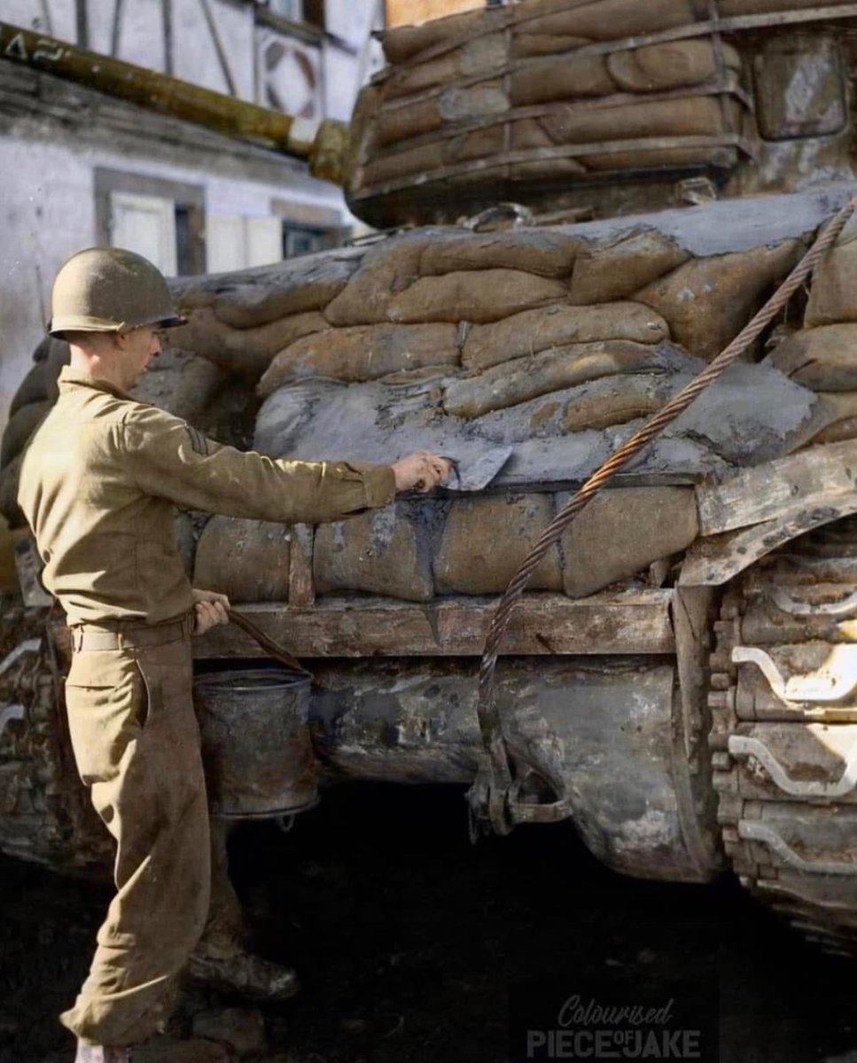 J&L Historical (@jason_r_burt) on Twitter photo Corporal Arthur Garrett of the 14th Armored Division works on adding additional armor to an M4A2 Sherman tank by applying cement to sandbags. ๐ช
<a href="/PieceJake/">Colourised Piece of Jake</a> on the colorization ๐จ Corporal Arthur Garrett of the 14th Armored Division works on adding additional armor to an M4A2 Sherman tank by applying cement to sandbags. ๐ช
<a href="/PieceJake/">Colourised Piece of Jake</a> on the colorization ๐จ