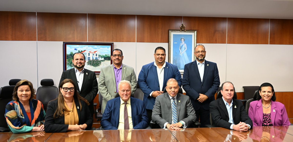 Chairman of the Commonwealth Enterprise and Investment Council (CWEIC) Lord Marland (front row, third left) made a courtesy call on Members of the Cabinet at the Government Administration Building yesterday Wednesday, 14 May.