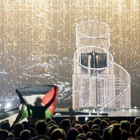 Trillian_01's tweet photo. They may have tried to mute the crowd, but you can clearly hear the dissenting voices. What an image. #Eurovision #FreePalestine https://t.co/a9cBDwawrK