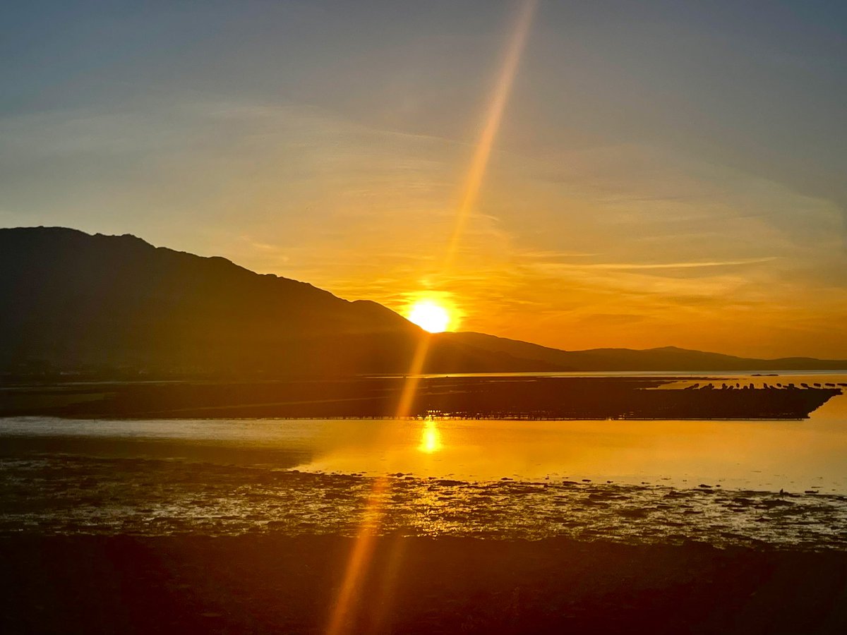 Glaring sunset behind Slieve Foy