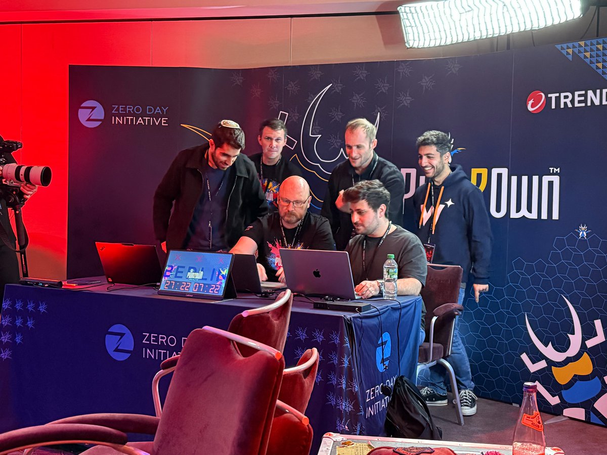 Marvelous! Benny Isaacs, Nir Brakha, Sagi Tzadik (<a href="/sagitz_/">sagitz</a>) of Wiz Research successfully popped Redis in the AI category. They head off to see if they are the second full win for AI in #Pwn2Own history. #P2OBerlin