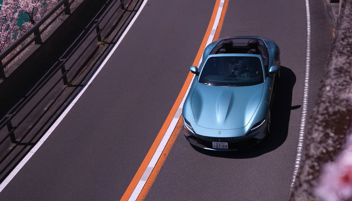 Drawn by the scent of cherry blossoms.

A spring journey with the #FerrariRomaSpider in Celeste Trevi.

#LaNuovaDolceVita #Japan
#Hanami #花見 #Ferrari