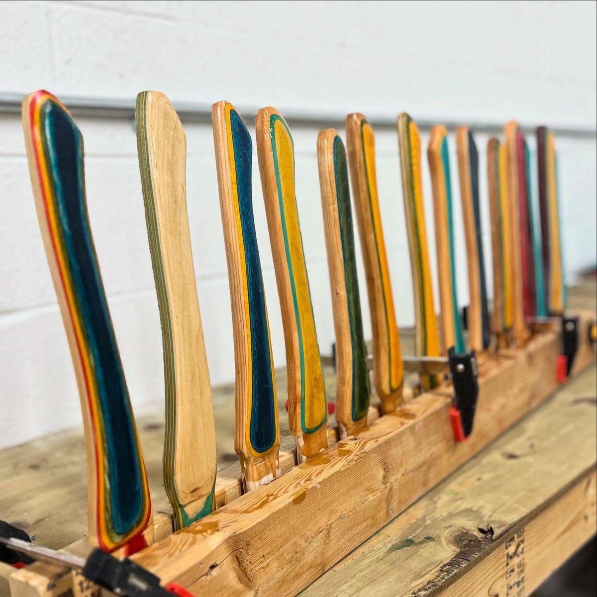 Check out this awesome rack of handmade axe handles in progress by @oldboy_smithy made with colored veneers!⁠
⁠
#roarockit #repost