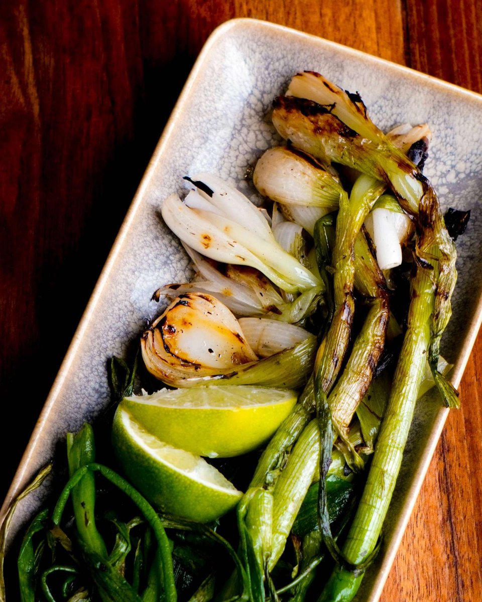 Let's get grilling season going with this taqueria classic grilled knob onions are here, fresh, and always grilled to order over our roaring wood-fire grill.