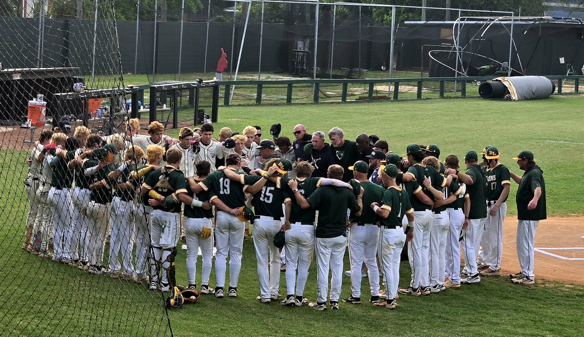 Two teams meeting for pre-game prayer. Praying for HHCA player Stone Burd.  His brother Slade brought out Stone's jersey with him for starting lineups