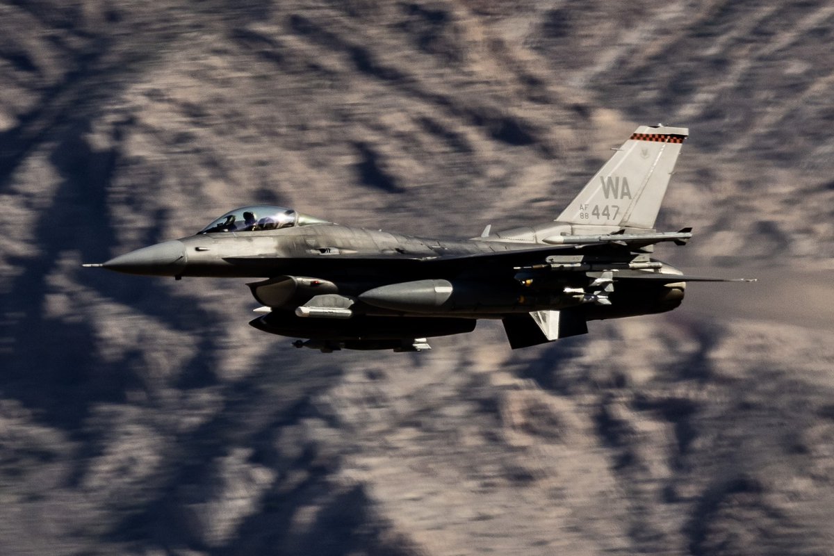 Nellis based f-16 with the cool mountain backdrop