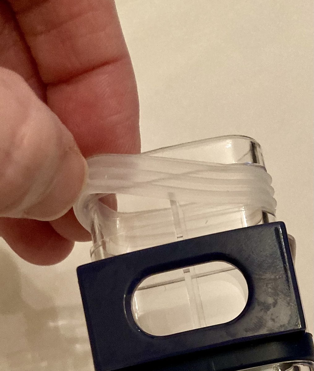 The silicone seal slid off easily.

I was nervous about cutting an angle into the hard plastic snorkel tube, so I decided to skip ahead to the valve install first.
Narrator: *The valve install was not, in fact, easier.*