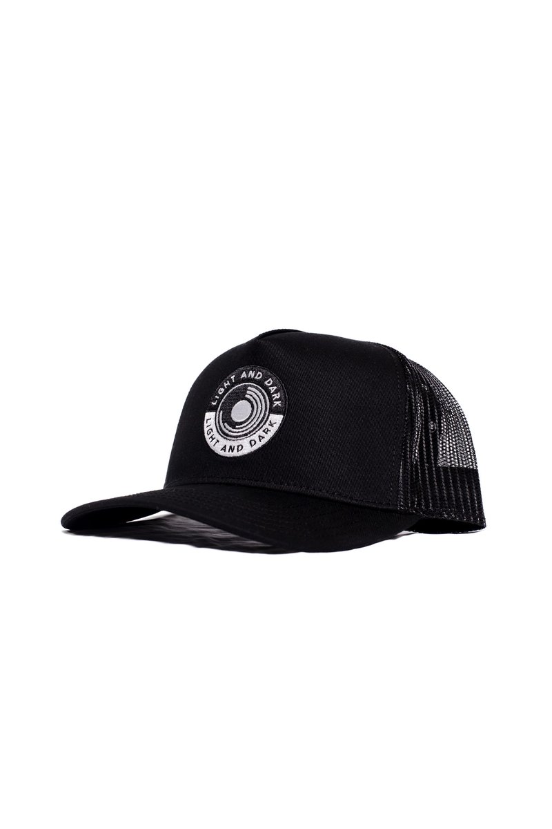 The LAD Graphic Trucker Hat just hits different — featuring the embroidered LAD icon, curved brim, and double snapback closure. Classic fit, bold statement. 🧢🔥 #LADStyle #TruckerHat #LightAndDarkClothing