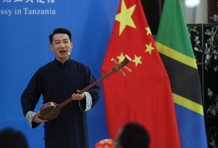 XHNews's tweet photo. The Chinese Embassy in Dar es Salaam became a stage for cultural connection. More than 40 Tanzanian officials, diplomats, and cultural figures gathered to experience Pingtan, a traditional storytelling art from southeastern China https://t.co/dKsDCfma69 #HelloAfrica https://t.co/wlJdumyLyf