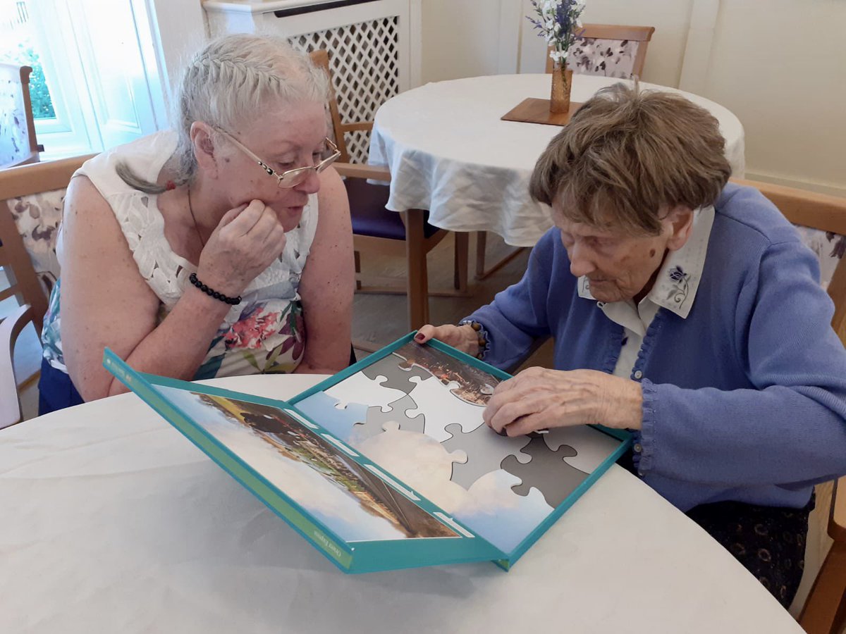 OrielCareHome's tweet photo. The ladies of the Jigsaw Club gathered around the table for an afternoon of activities earlier this week, puzzling away while enjoying a cheerful sing-song! 🧩🎶

#Jigsaw puzzles are a fun way to keep an ageing mind active, support memory, and encourage teamwork! ��

#carehome https://t.co/EEdjlvp9I0